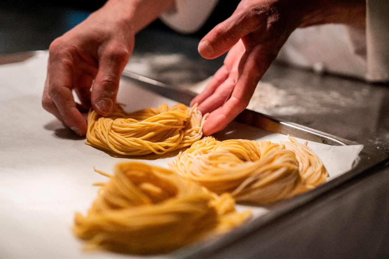 A person making pasta